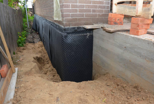 Happy homeowners after waterproofing job in North Adams